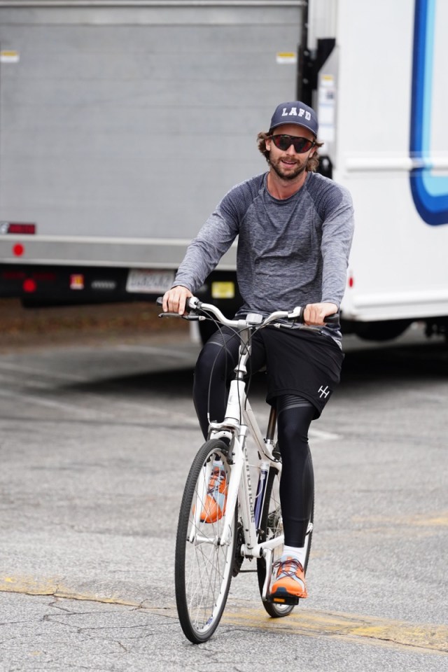 patrick schwarzenegger cycling in gray shirt