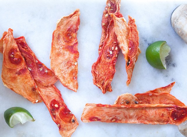 watermelon jerky strips on a marble counter