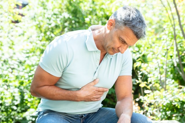 portrait of a mature man having heart attack