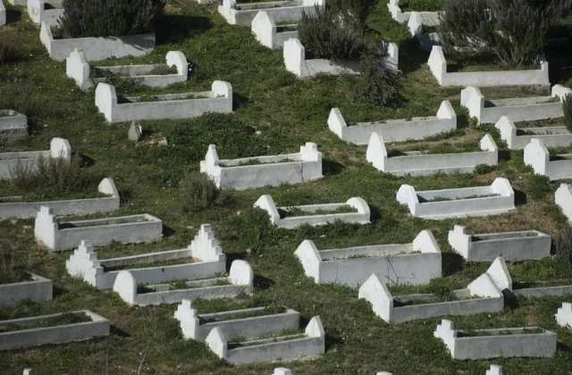 Funeral for two migrants who died in