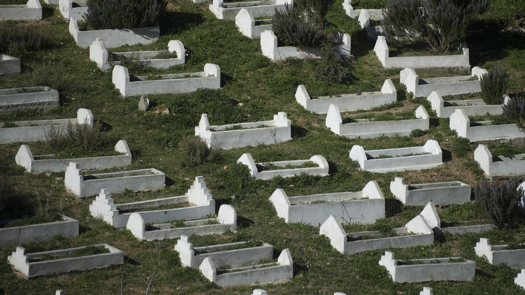 Funeral for two migrants who died in