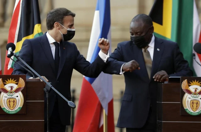 visits South Africa, Macron pleads for