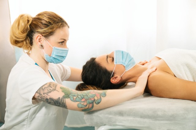 woman receiving a physiotherapeutic shoulder massage