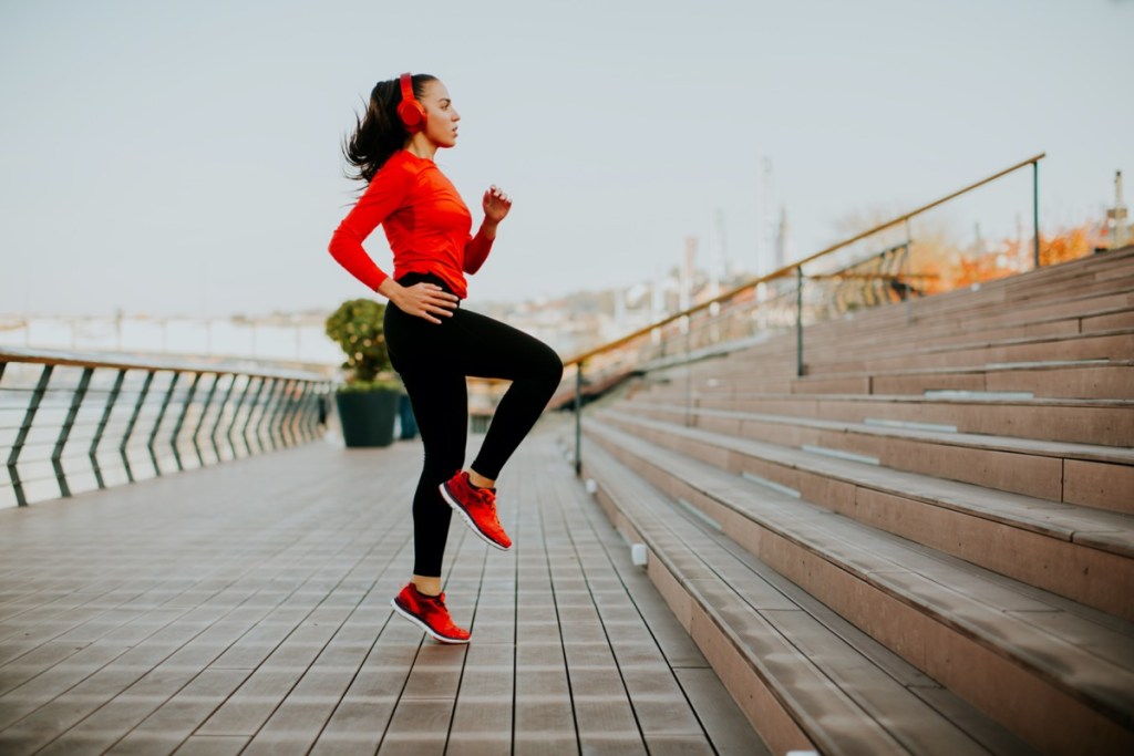 View of young woman exercising outside