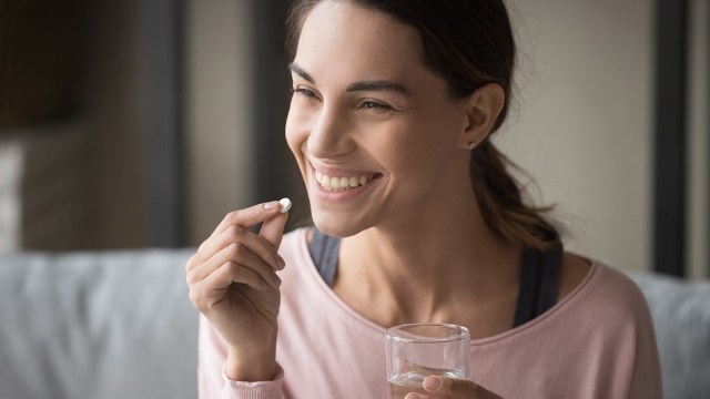 woman taking a multivitamin