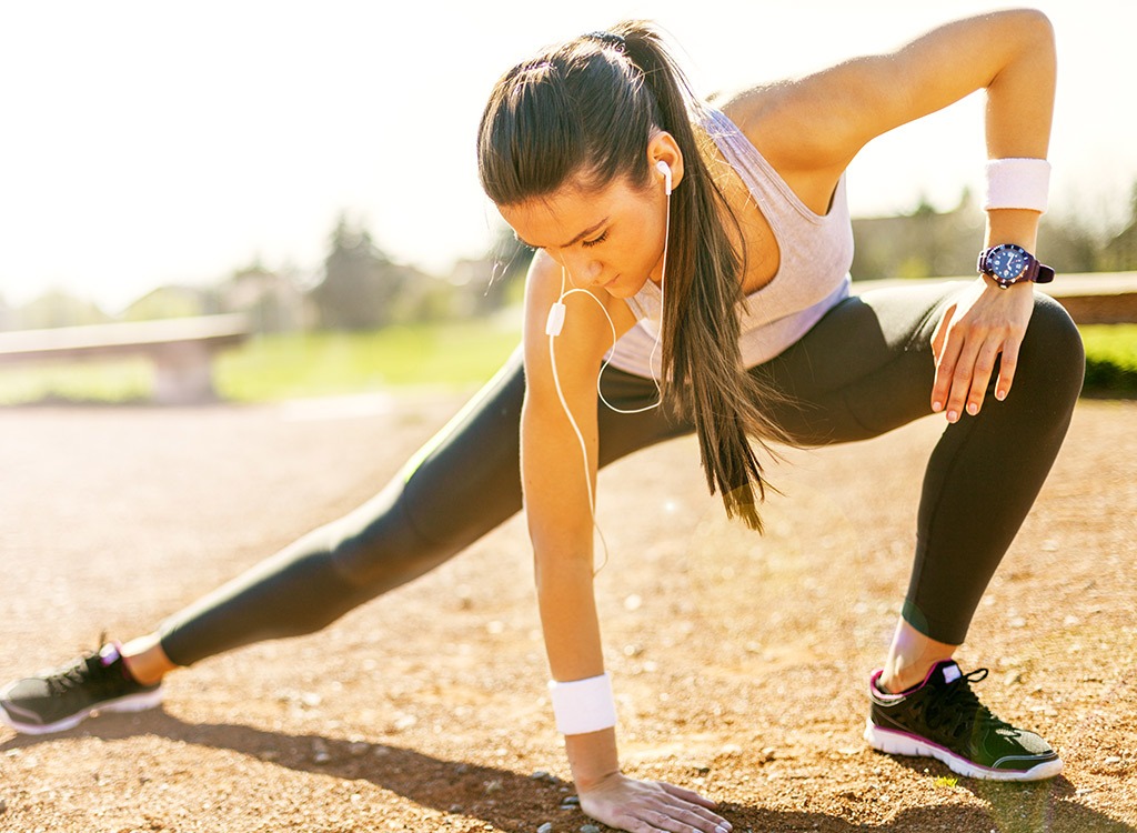 woman stretching before a run