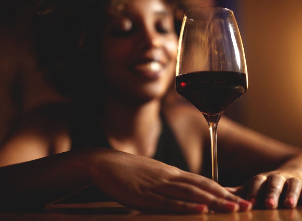 black woman drinking red wine