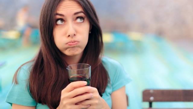 woman with soda glass in a restaurant