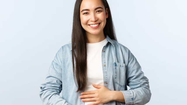 happy woman hands on belly