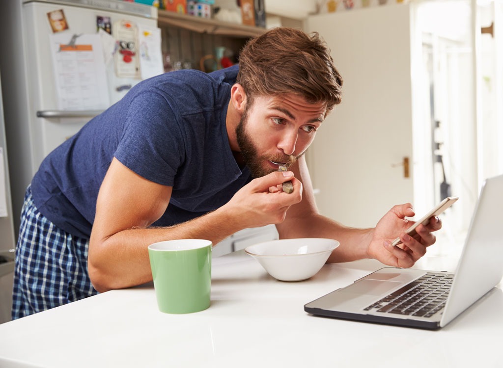 man rushing through quick breakfast