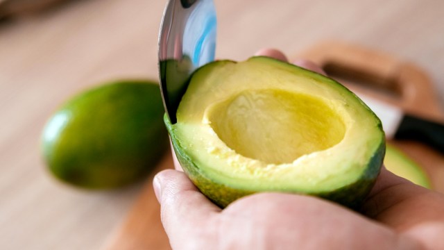 scoop avocado out of peel cut