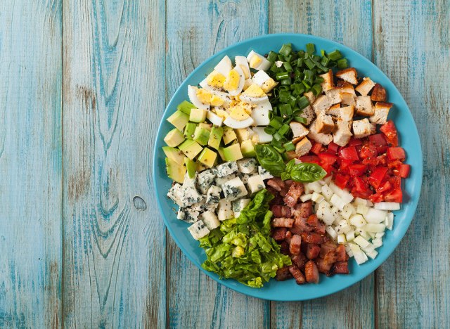 cobb salad against blue background