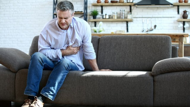 mature man having heart attack at home