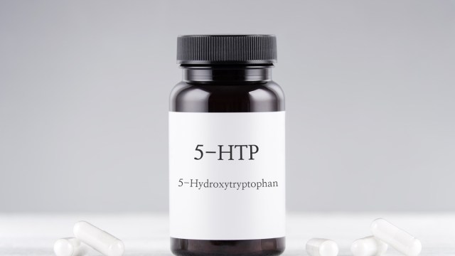 bottle of 5-htp supplement on white background