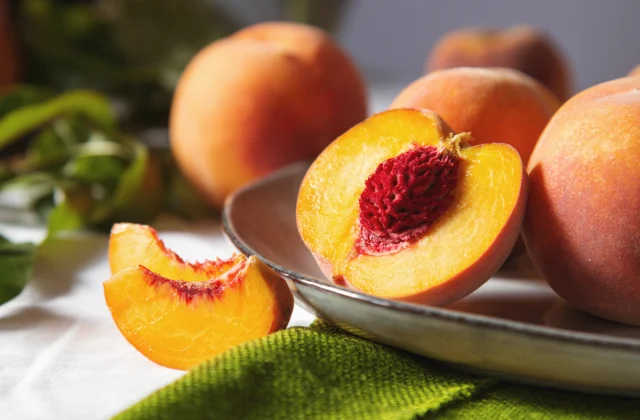 One Major Side Effect of Eating Peaches, Says Dietitian