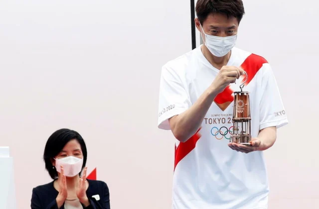 Tokyo welcomes Olympic flame without fans, in