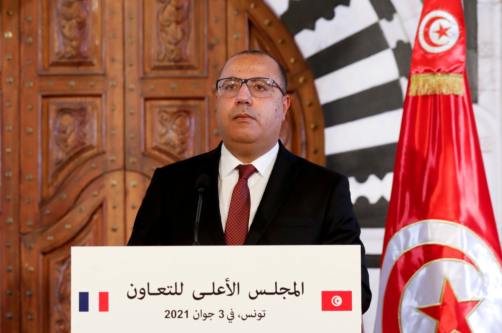 Tunisia's Prime Minister is leaving his large parliament