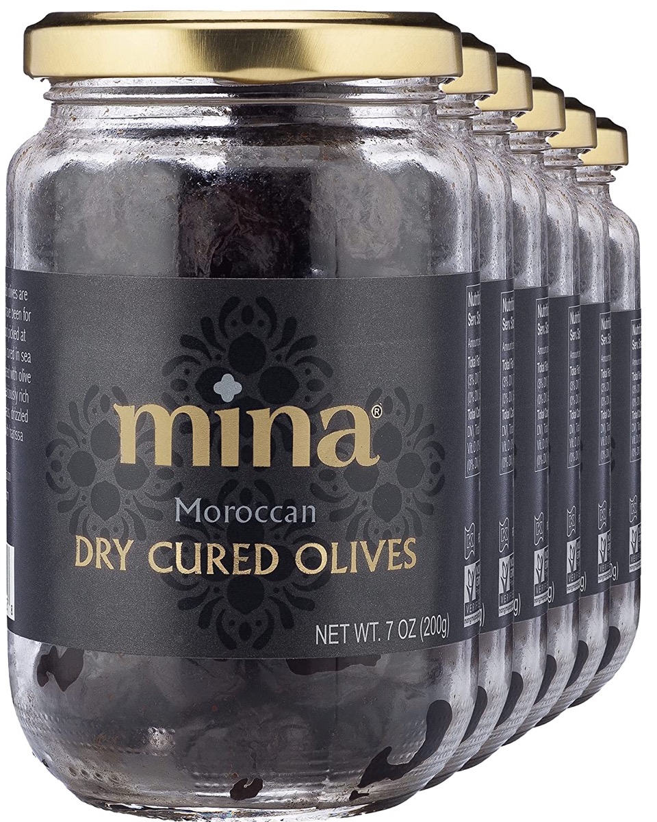 several jars of my Moroccan dry hardened olives on white background