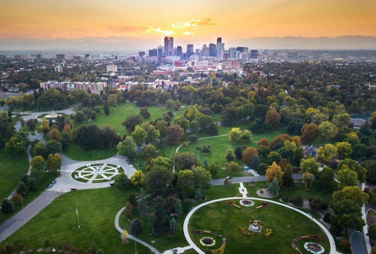 sunset over denver cityscape, aerial view from city park