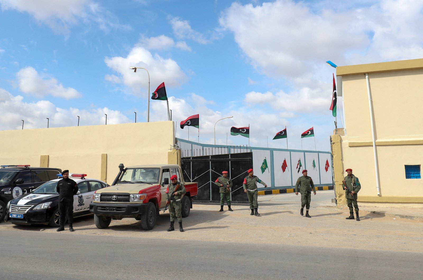 Libya's armed convoy returns from Tripoli after