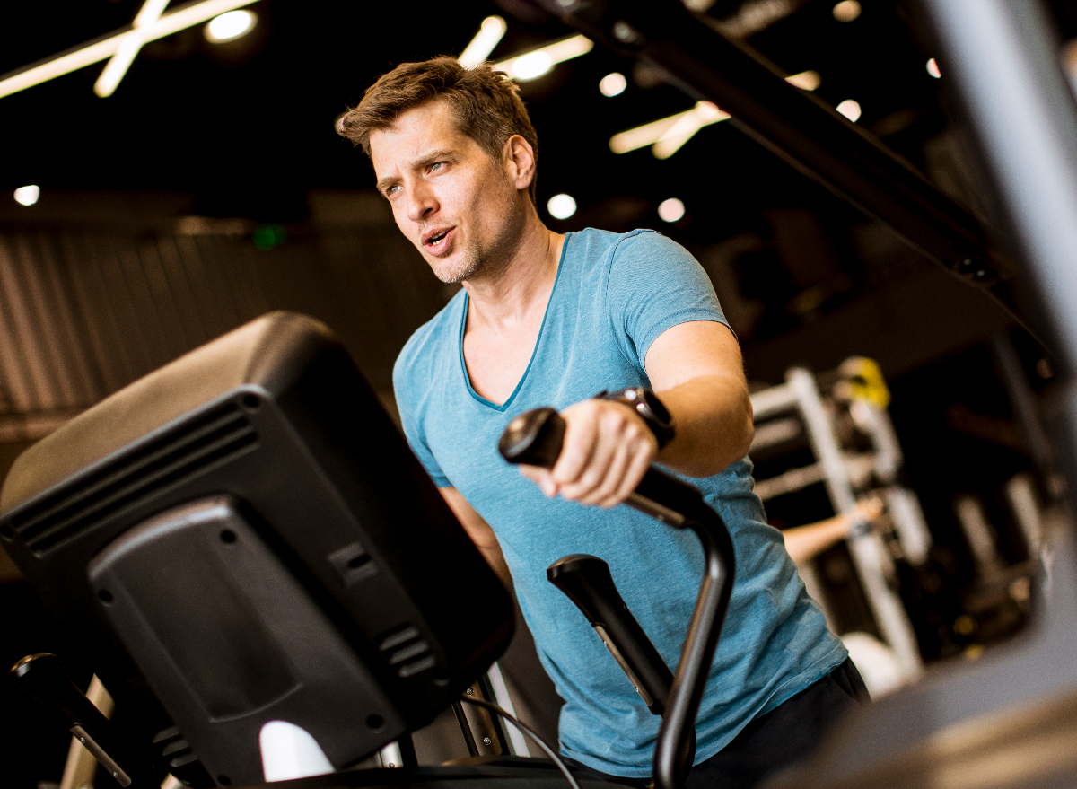 fit man on elliptical, concept of cardio training to keep fit as you age