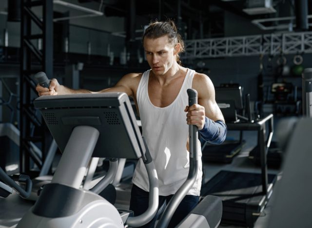 fit man uses elliptical