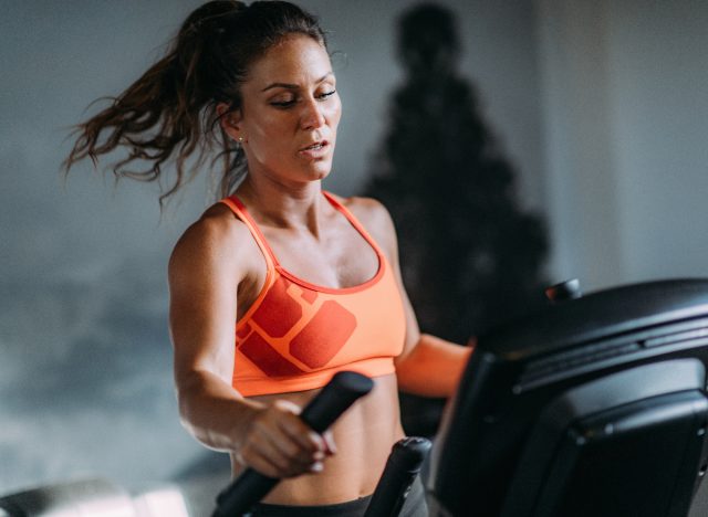 fit woman on elliptical, concept of worst exercises for weight loss