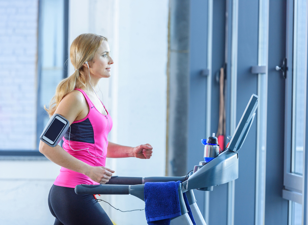 woman performing cardio training treadmill