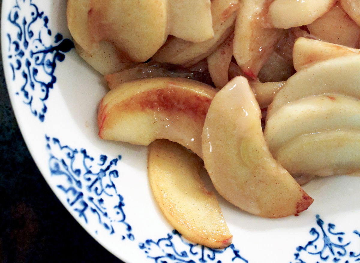 as many as 30 sautéed apples in a decorative bowl