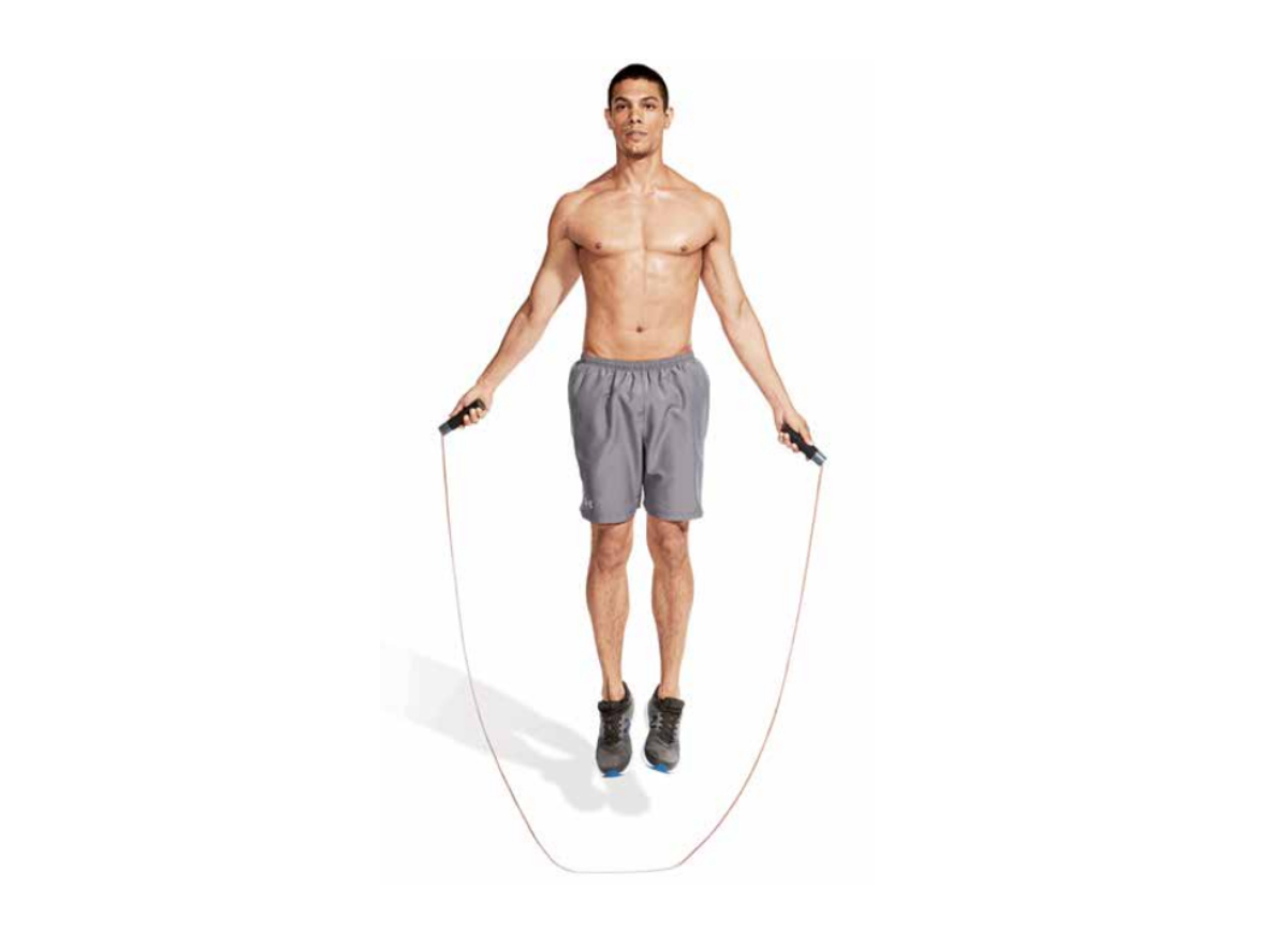 fit muscular man jumping rope