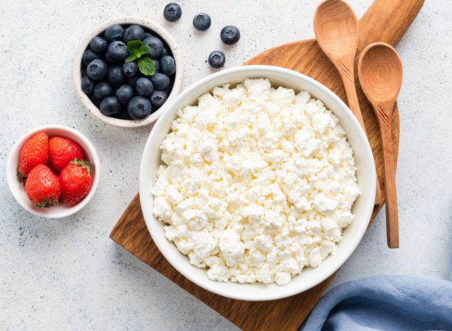 bowl of cottage cheese with strawberries and blueberries