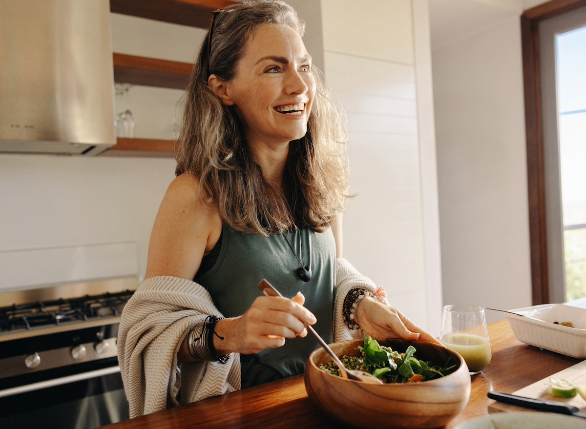 happy woman making healthy meal, concept of simple daily habits for weight loss