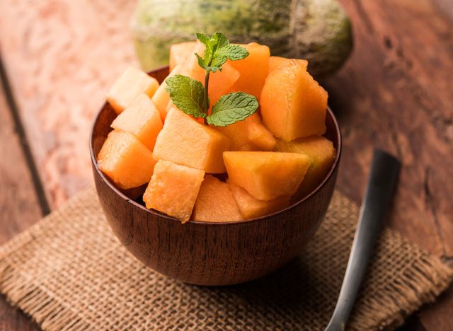 wooden bowl with sliced ​​cantaloupe