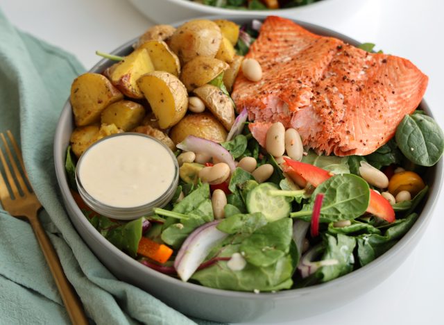 high protein salmon salad with roasted baby potatoes, beans, spinach, avocado with creamy lemon dressing