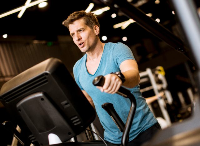 fit man on elliptical, concept of cardio training to keep fit as you age