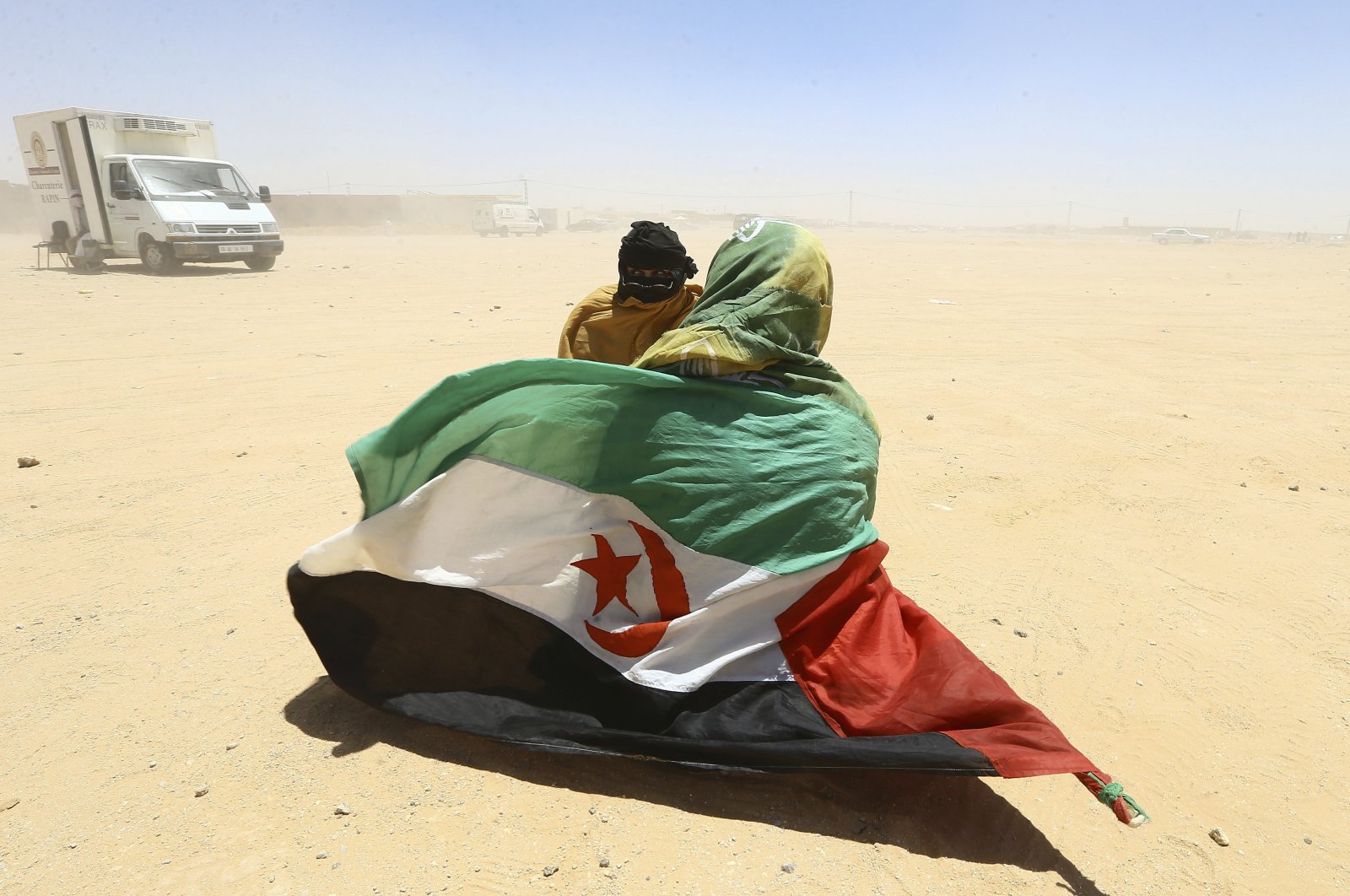 Algeria recalls envoy as France backs Moroccan