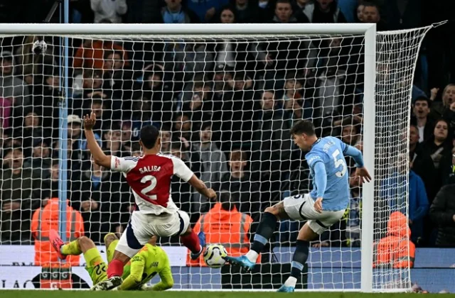 Stones Secures Late Draw for Man City in Premier League Showdown