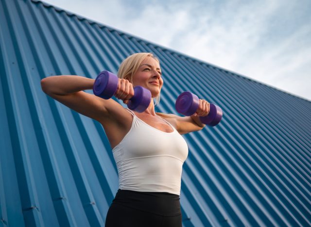 woman lifting weights, concept 75 hard challenge training