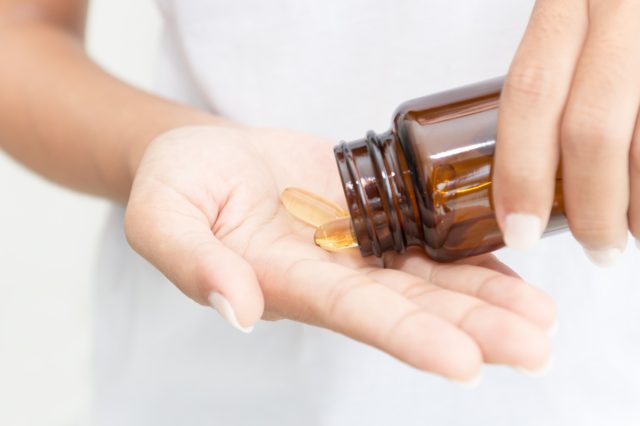 woman taking fish oil