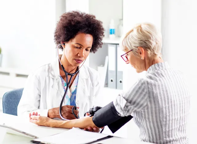 woman taking blood pressure