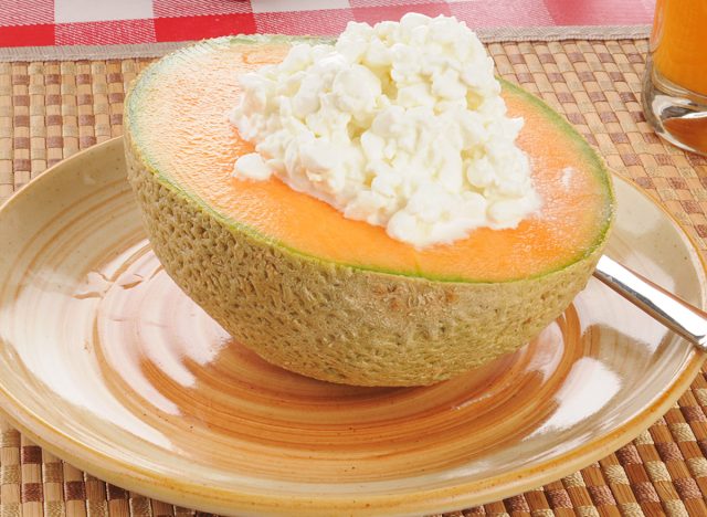 a cantaloupe with cottage cheese