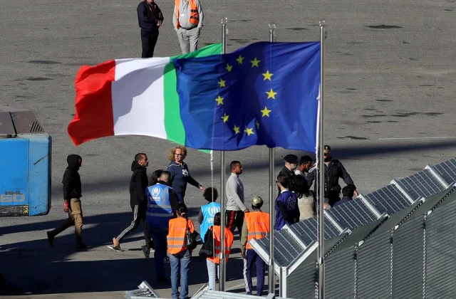 Italian Navy Delivers First Group of Migrants to Reception Center in Albania