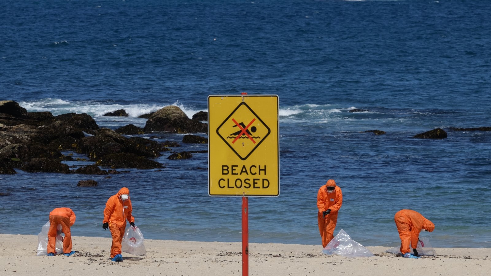 Sydney beaches re-open after 'mystery' balls wash ashore