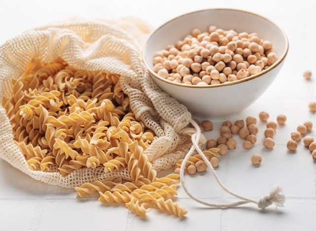 chickpea leg fusilli pasta on a white tile background