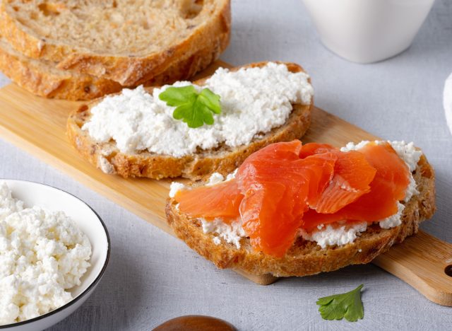 sandwich with salted salmon and cream cheese on a rustic background