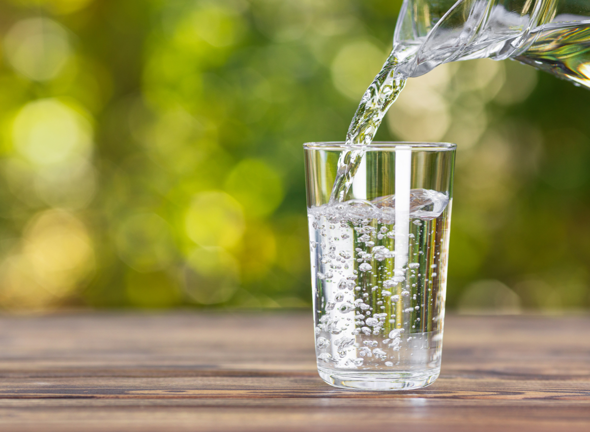 pour water into glass