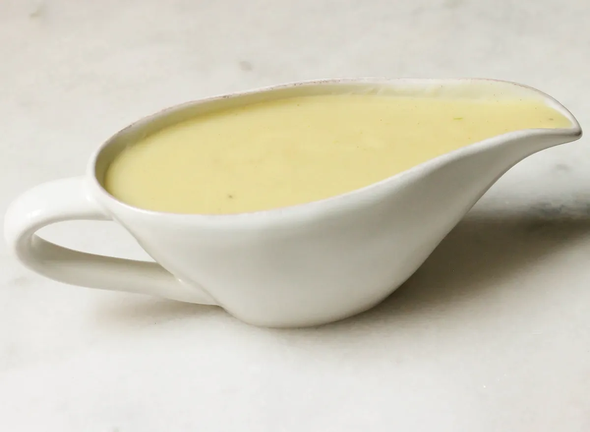 homemade sauce recipe in a sauce boat on a marble counter