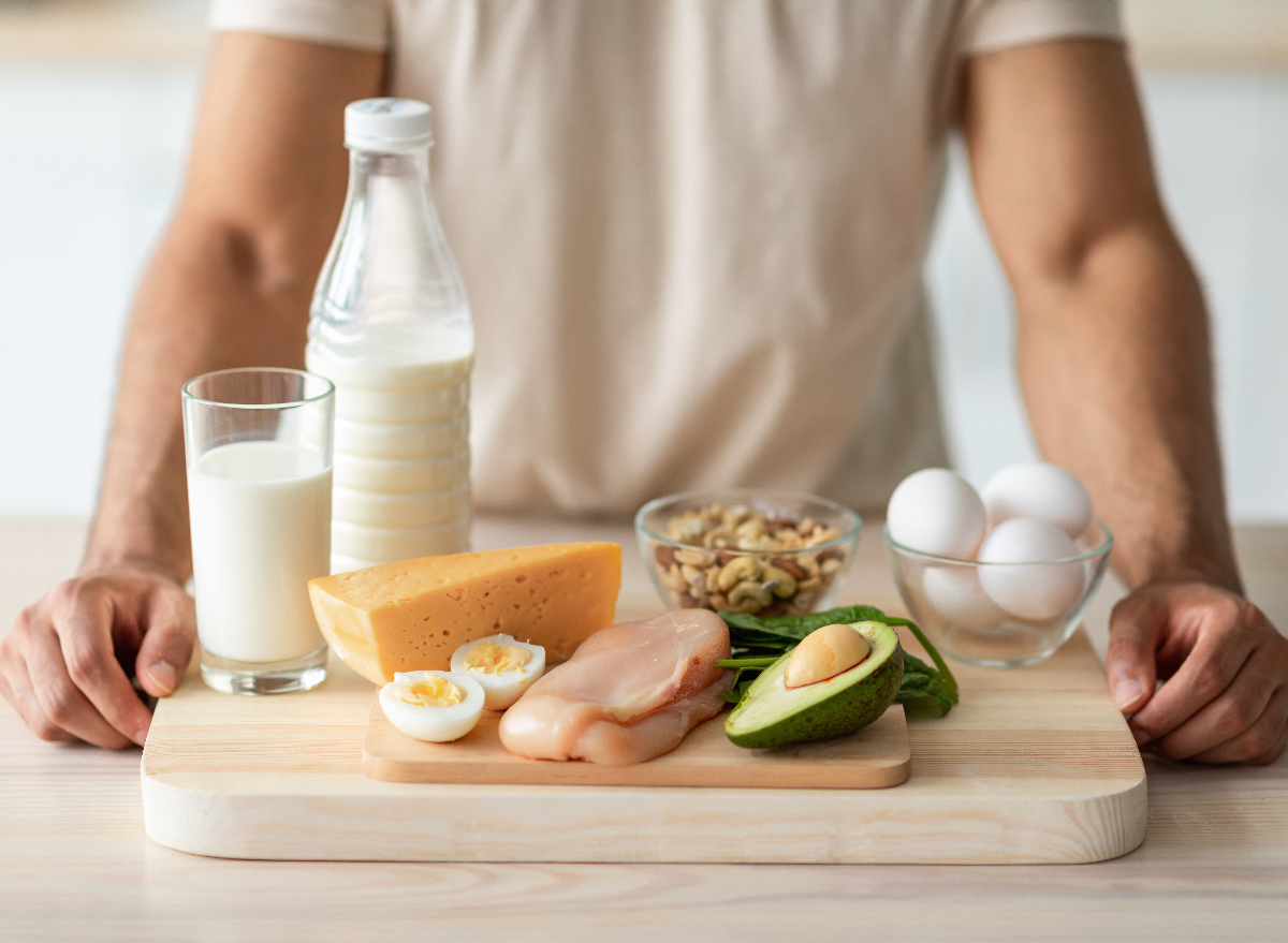 cutting board with different protein foods on it in the kitchen