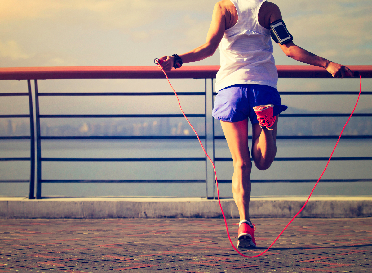 woman jumping rope outside