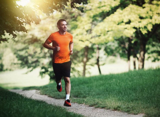 man running outdoors, concept of training sessions to increase stamina and endurance